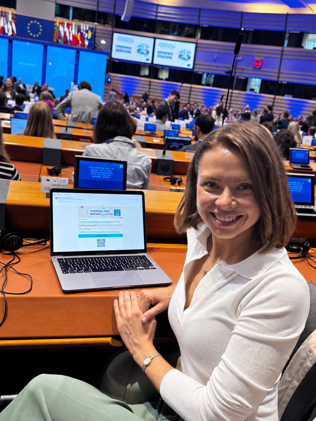 Liene Daktina seated in the European Parliament chamber