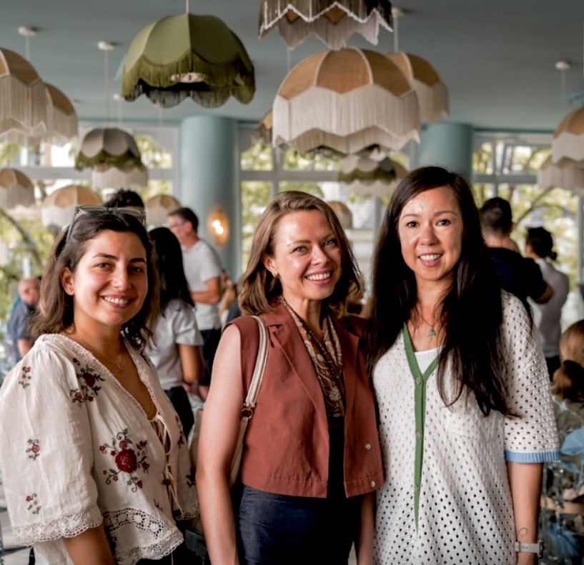 Liene Daktina with colleagues on a summer terrace