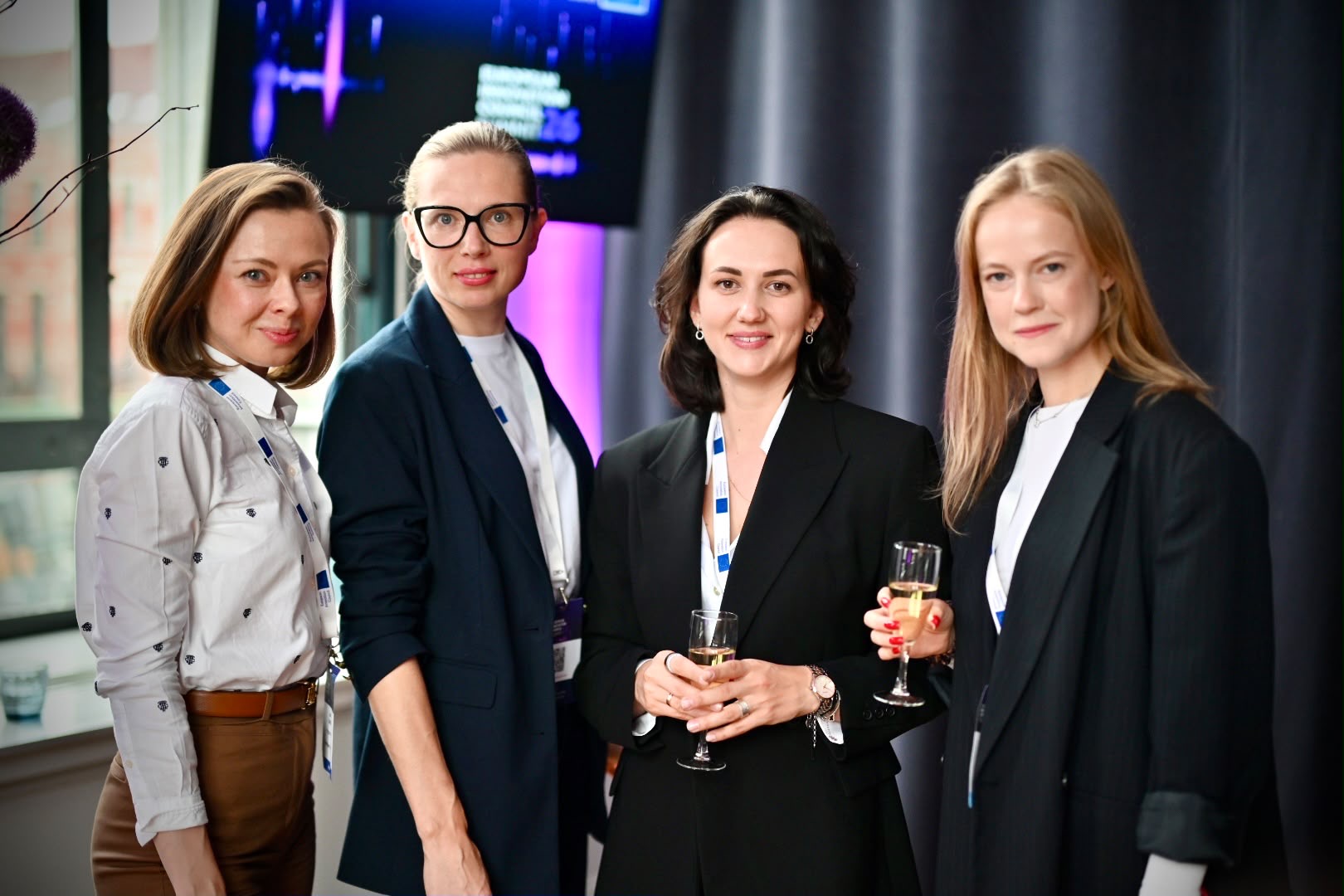 Liene Daktina with colleagues at a European forum reception