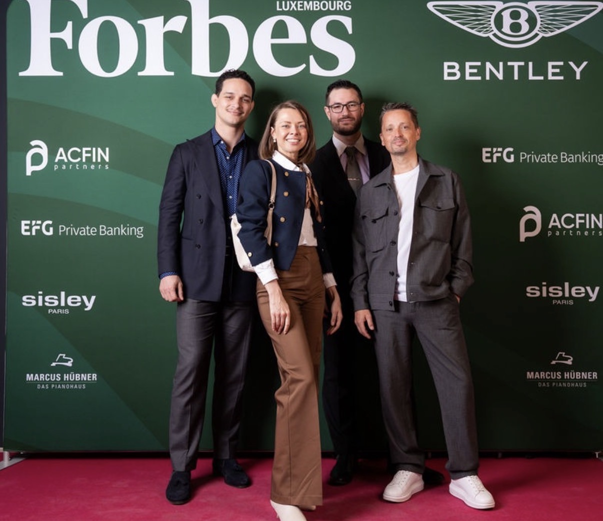 Liene Daktina with colleagues at the Forbes Luxembourg event
